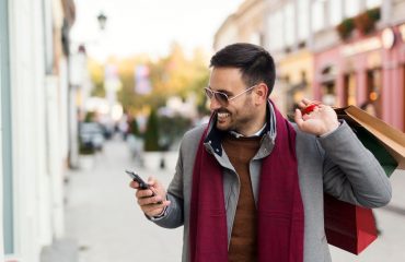 Man holiday shopping with bags